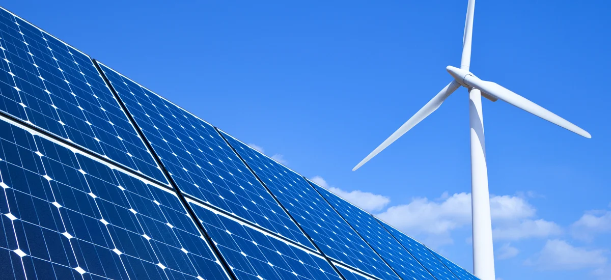 sustainability-featured-image sustainability image of solar panels and wind turbine